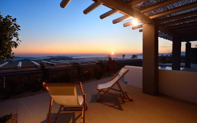 balcony area with sunset view