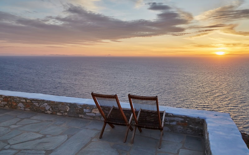 sunbeds overlooking the sea at sunset