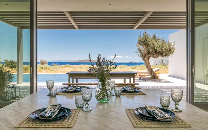 dining area with pool and sea view