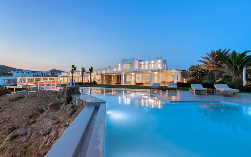 villa with a pool at night
