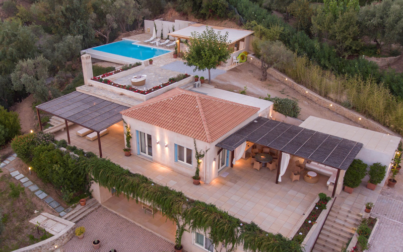 aerial photo of a villa and pool area