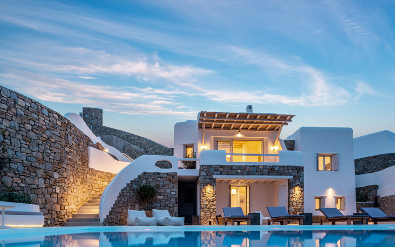 villa and pool area at night