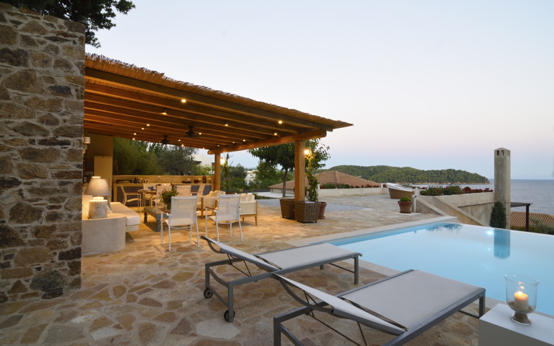 sunbeds by the pool at sunset