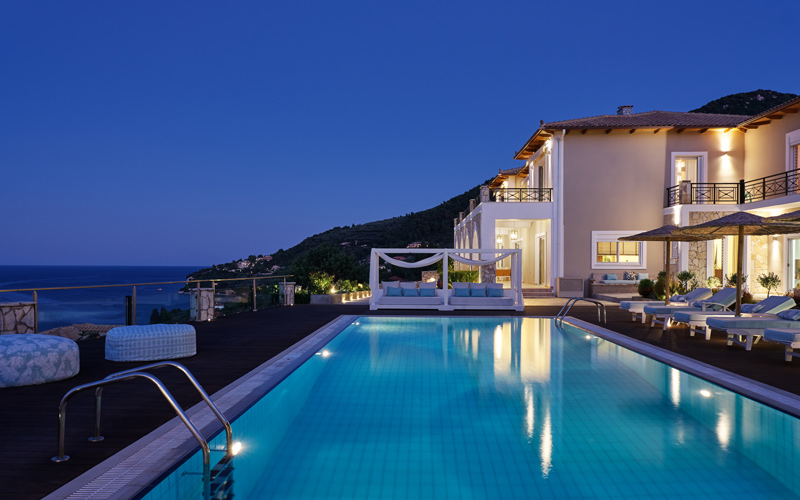 villa and pool area at night