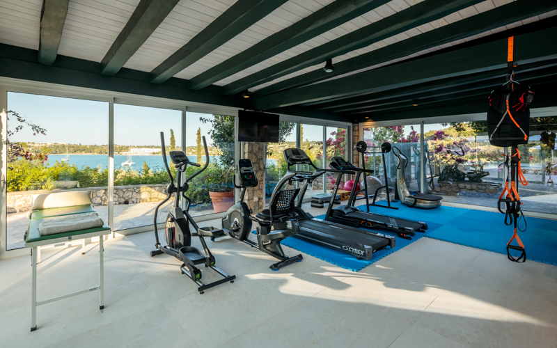 glass room gym area next to the pool