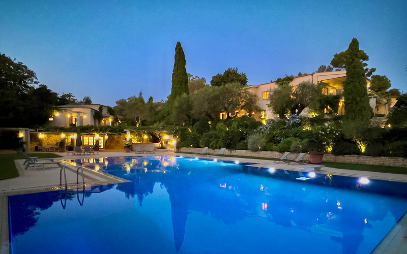 villa with pool at night