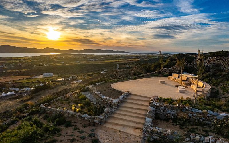 outdoor lounge area with sunset view