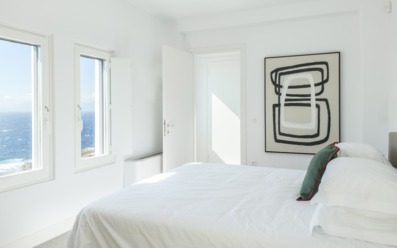 bedroom with double bed and sea view