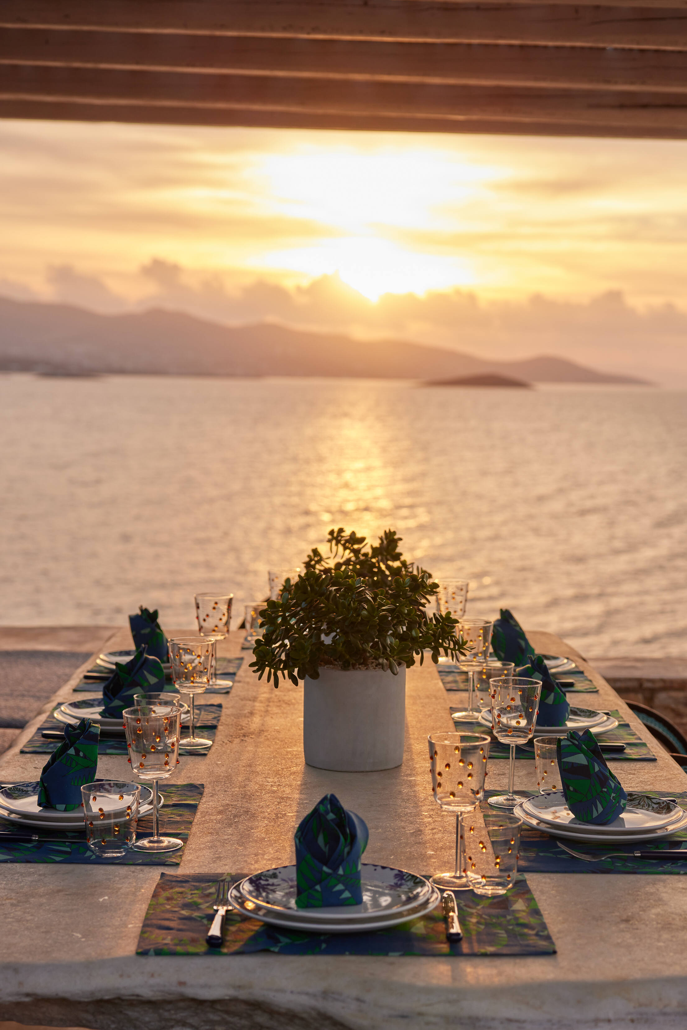outdoor dining area with sunset view