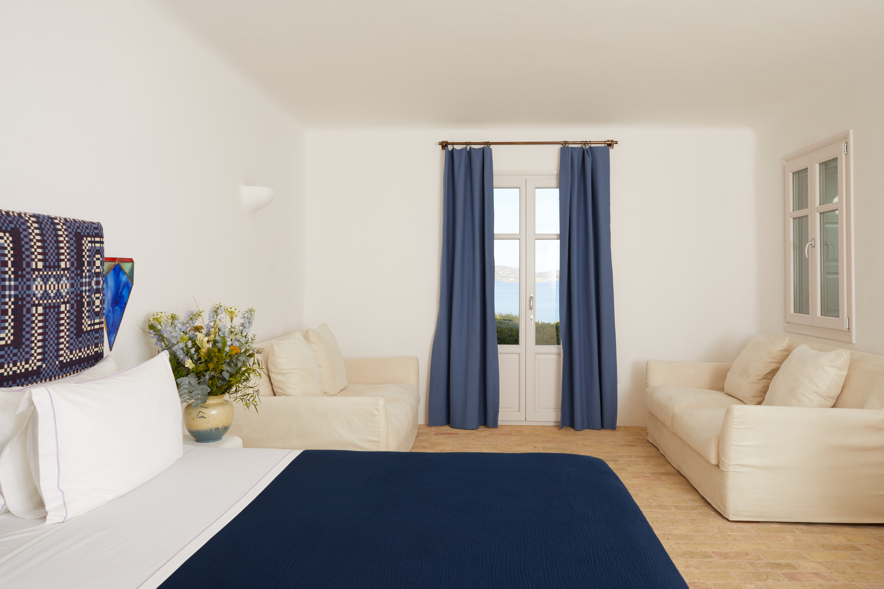 bedroom with double bed and sofa