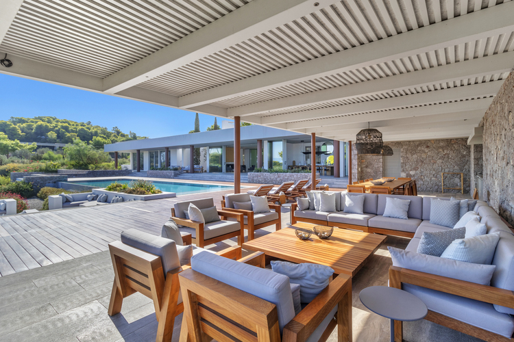 outdoor lounge area with sofa and chairs