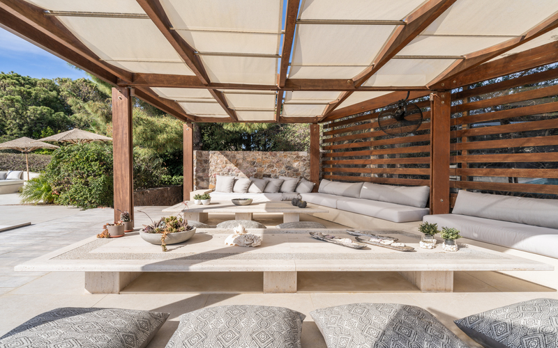 outdoor lounge area with sofa and chairs