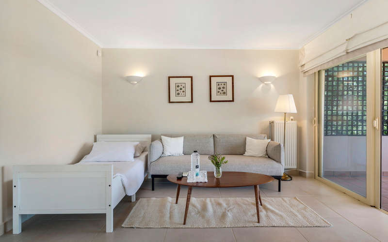bedroom with single bed and sofa