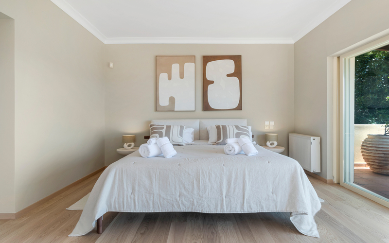 bedroom with double bed and access to pool area