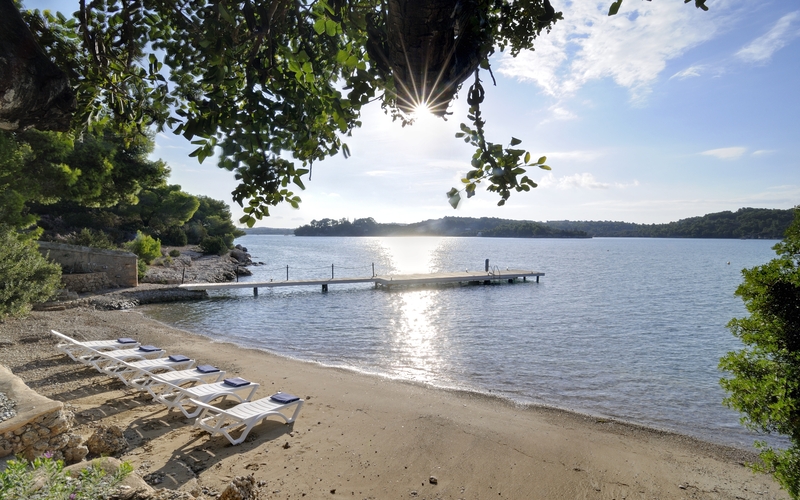 secluded beach with private dock