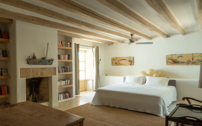 bedroom with double bed and fireplace