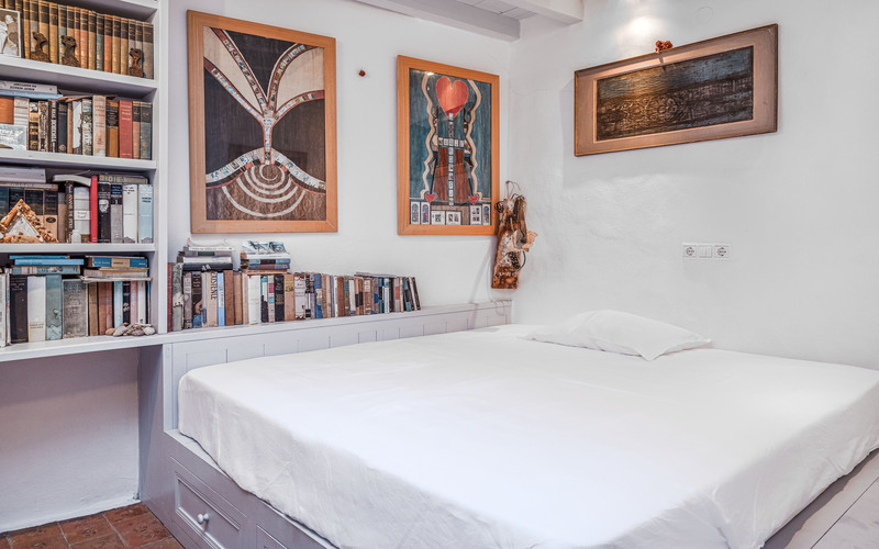 bedroom with double bed and library