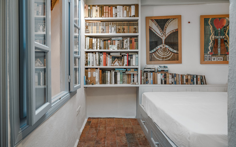 bedroom with double bed and library