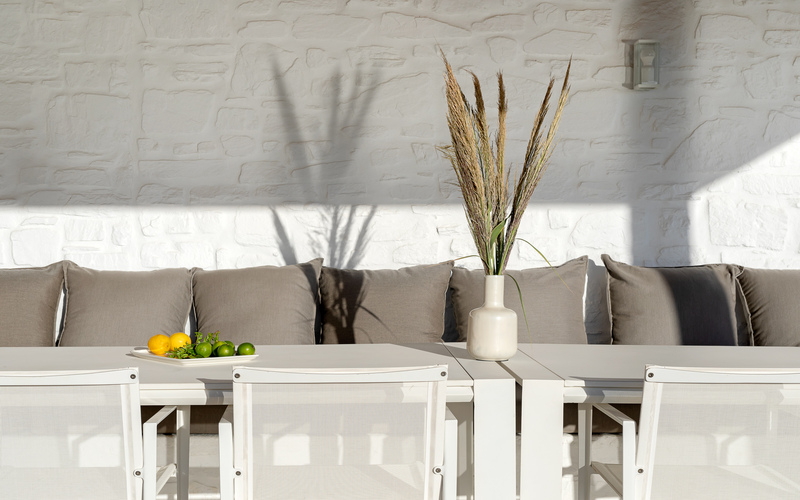 outdoor lounge area with sofa and chairs