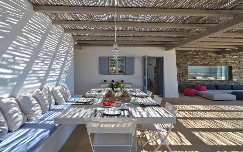 outdoor lounge area with sofa and chairs