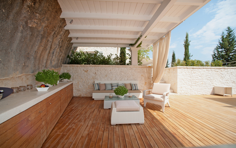 shaded lounge area on a wooden deck