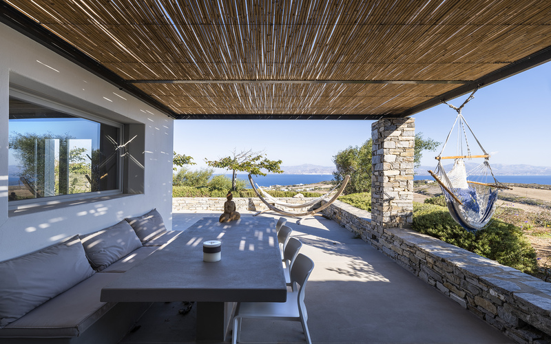 outdoor lounge area with sofa and chairs