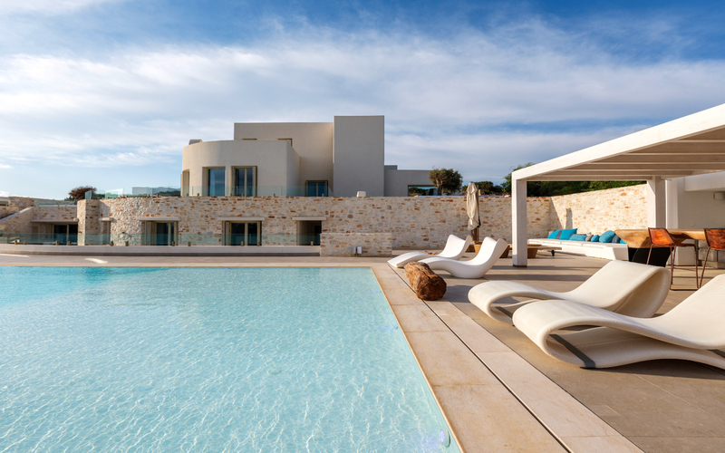 pool area with lounge area and hammock