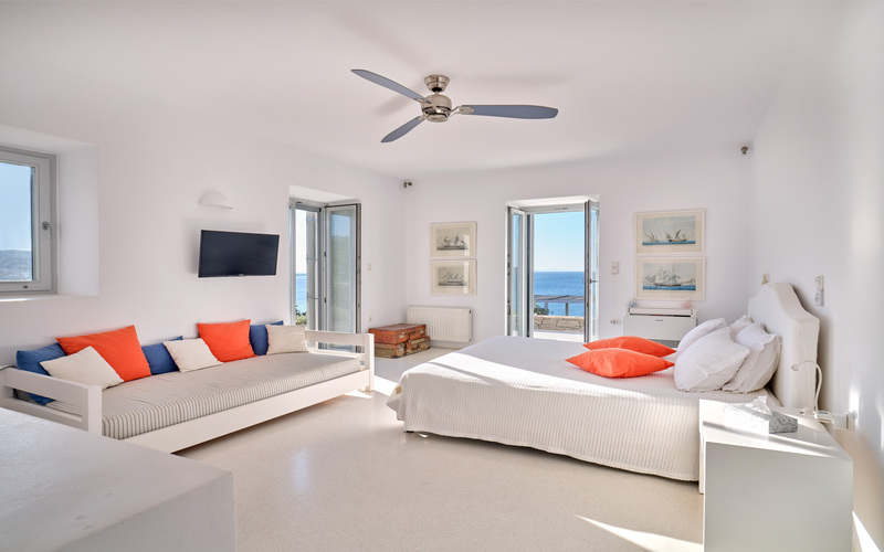 master bedroom with sofas and TV