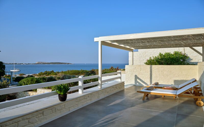 balcony with sea view and sunbeds