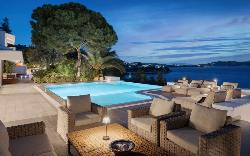 pool area with sunbeds at night