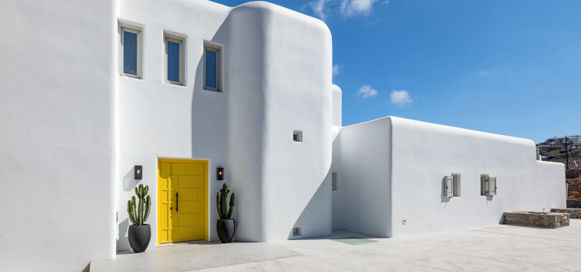 main entrance with yellow door